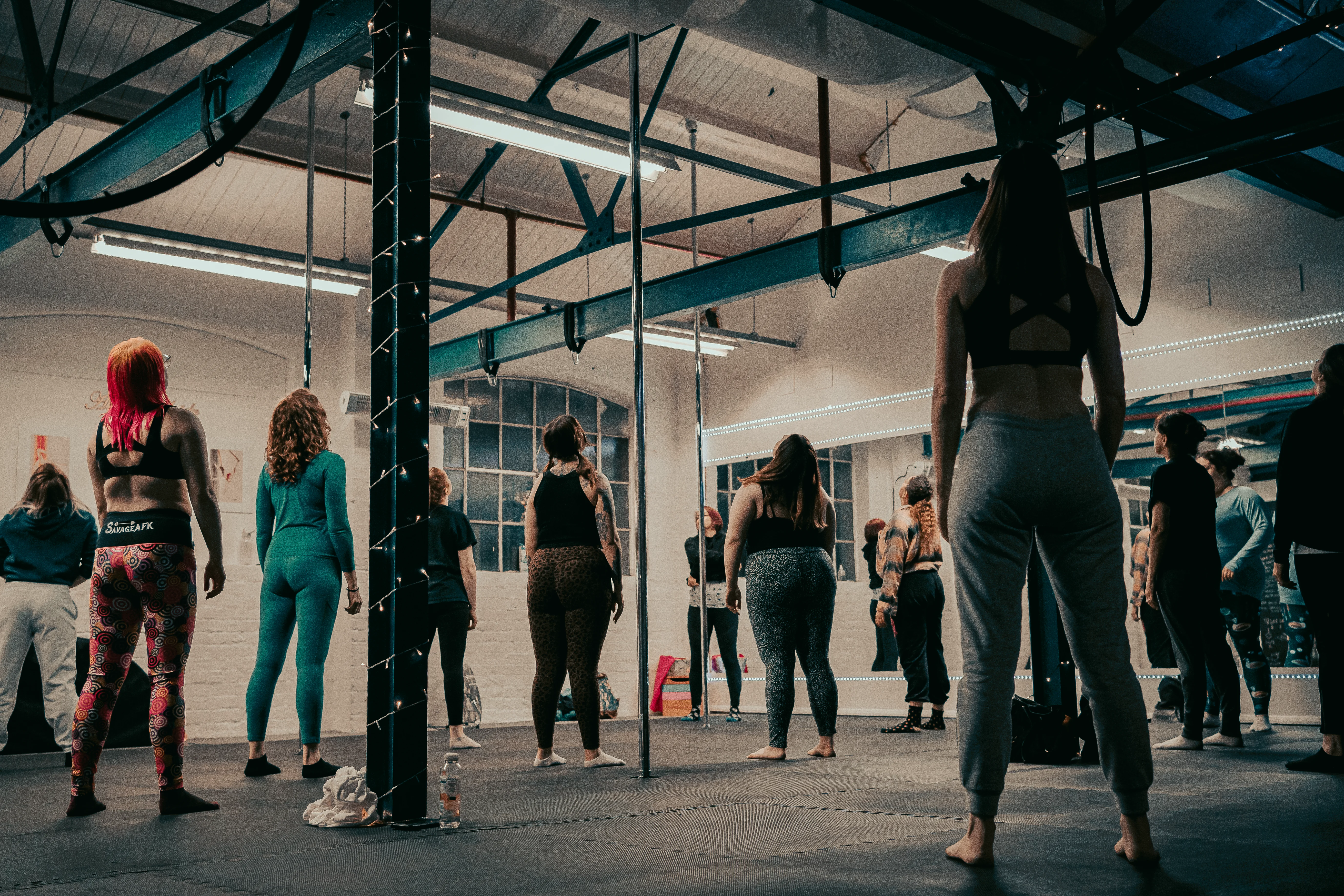 Group of women smiling during aerial fitness class